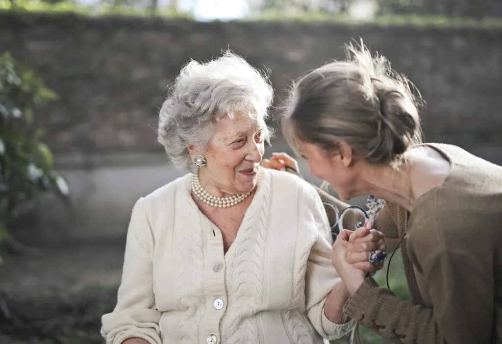 A baby boomer woman with her daughter.