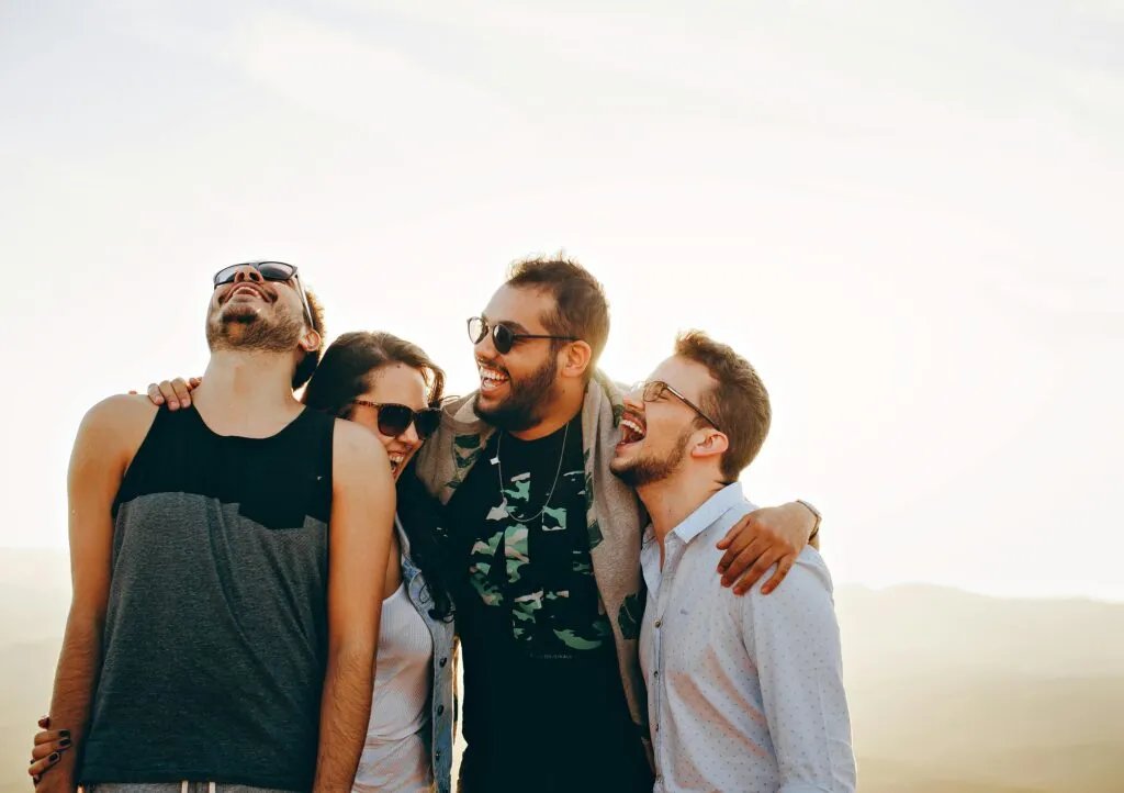 A group of millennials laughing.