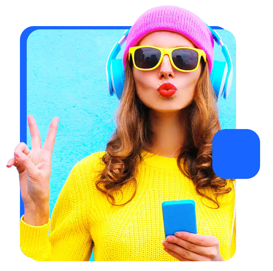 A woman wearing bright clothing, a beanie, and headphones, representing someone you can reach with student marketing data.