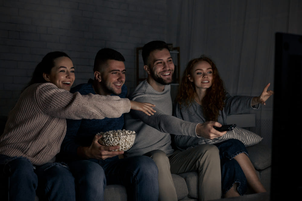 A group of friends watching TV, representing connected TV advertising