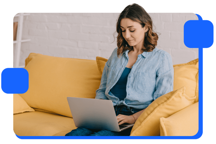 A woman on her laptop, representing the recipient of an email acquisition campaign.